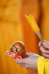 Temple block Mu-Yu. Buddhist percussion during ceremony. France.