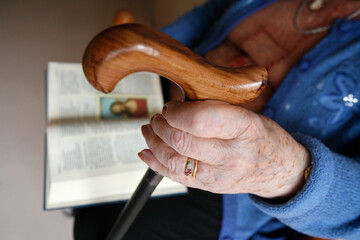 Reading the Bible in a retirement home. France.