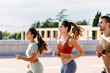 © Xavier Lorenzo - Three young athletic friends jogging together outdoors in summer. Healthy lifestyle and sport concept
