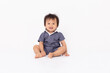 © 220 Selfmade studio - Smiling Toddler Sitting on Floor in Blue Outfit