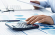 © tadamichi - Audit accounting and financial analysis. Many reports and calculator. Accountant calculating tax.