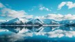 © Leli - Snow-capped mountains reflect in serene Alaskan fjord