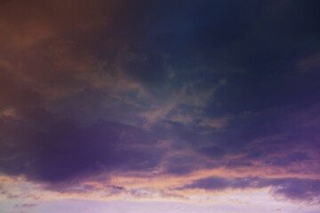 Poster - Beautiful sunset sky above clouds with dramatic light. Cabin view from airplane