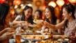 © liliyabatyrova - A group of four Chinese women enjoy a meal together at a restaurant, laughing and sharing dishes. The warm lighting and cozy atmosphere create a sense of intimacy and celebration