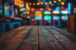 © BetterPhoto - Blurred background of a lively arcade with colorful lights and games, creating a nostalgic and fun atmosphere. The foreground features a wooden table for copy space.