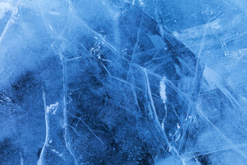 beautiful crystalline ice texture. cold background of blue ice with cracks and lines of icy surface 