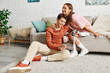 © Bliss - A couple enjoying time together in their home, the woman is wearing a prosthetic leg.