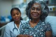 © Vibu design  gallery - Close up of senior black woman on hospital bed with young nurse supporting her