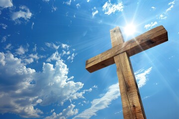 Wooden Cross against a vibrant blue sky with clouds and sunlight. Symbol of faith, hope, and religion in a serene, spiritual setting.