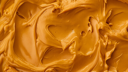 Wall Mural - Peanut butter background, top view. Peanut butter texture. Spread swirl. Organic keto food. Healthy creamy paste. Smooth closeup brown desert. Crunchy macro snack. Fat salt breakfast