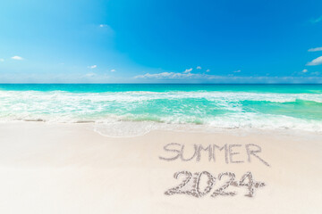 Wall Mural - Tropical beach with Summer 2024 written on the sand