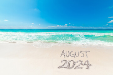 Wall Mural - Tropical beach with August 2024 written on the sand