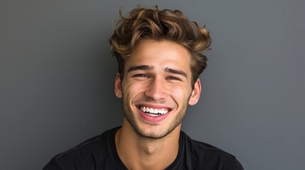 Wall Mural - Young man with beautiful smile on grey background. Teeth whitening