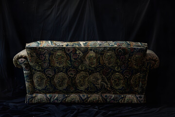 Canvas Print - rear angle back of old couch, on black background,