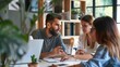 © Vitalii Shkurko - Happy couple sitting together at home, using a laptop and reviewing documents, showcasing teamwork and a positive relationship.