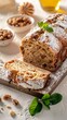 © Leli - A freshly baked apple bread loaf, sliced and dusted with powdered sugar