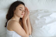 © New Africa - Bedtime. Beautiful woman sleeping on bed in morning, top view. Space for text