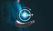 © Supatman - Nonstop service 24 hr concept. businessman hand holding virtual 24-7 with clock on hand for worldwide nonstop and full-time available contact of service concept. Assistance customer services,