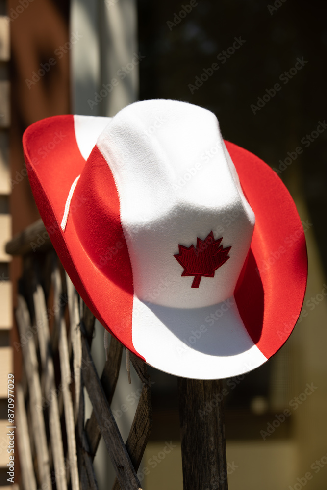 Product photo of a cowboy hat with a Canadian Flag design. The hat is ...