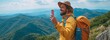 © tongpatong - Young hiker man shooting selfie image on top of the mountain