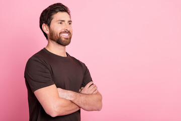 Wall Mural - Photo of toothy beaming man with stylish bristle dressed brown t-shirt arms folded look empty space isolated on pink color background