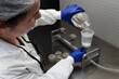 © Eomer2010 - Lab technician in lab coat and gloves is filtering and analyzing water
