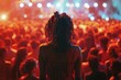 © Fotograf - Woman standing in front of a crowd at a live music concert, great for events or festival scenes