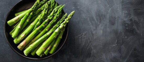 Wall Mural - Green Asparagus on Black Plate