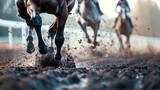 Horse racing action on muddy track. Powerful hooves churn the muddy racetrack as horses and jockeys compete in the heat of competition.