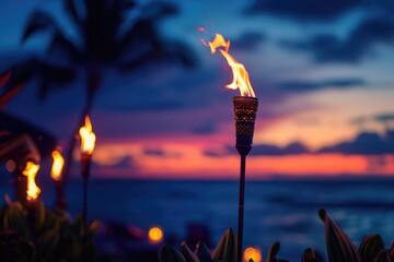 Wall Mural - hawaii party. sunset beach with fire torches - hawaiian lights burning at dusk