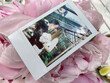 © Hernandez & Sorokina/Stocksy - Newlyweds Instant Photo On Pink Flowers Background