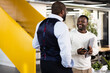 © VICTOR TORRES/Stocksy - Two African American businessmen discussing in a modern office