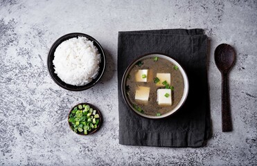 Wall Mural - Seaweed soup with tofu and scallions in a bowl