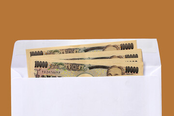 Ten Thousand Yen Bills, Japanese Yen Notes in a white paper envelope