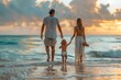 © mattegg - Family Walking On Beach At Sunset