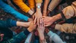 © Yeivaz - Diverse group of people joining hands together in a circle showing teamwork and unity
