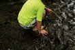 © Kathrine Schleicher/Stocksy - Child at Play in Mountain Stream