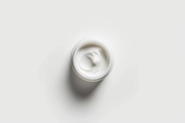 Poster - A single serving size of cream on a clean and simple background, ideal for food or cosmetic related compositions