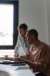 © Alba Vitta/Stocksy - coworkers teamwork office