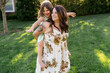 © Lea Jones/Stocksy - Mother and daughter playing together in the yard