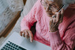 © RemsH - an elderly person with a laptop, technology and seniors, scam, isolation, vulnerable
