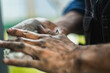 © Ivan Andrianov/Stocksy - Washing Hands After A Difficult Car Repair Work