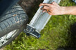 © Ivan Andrianov/Stocksy - Outdoor Garage Work Repairing Car Parts