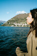 © Mal de Ojo Studio/Stocksy - Contemplative Woman by Lake Como
