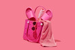 © Juan Moyano/Stocksy - pink rubber bag with different pink items