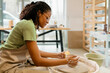 © Artem Podrez/Stocksy - Woman Entrepreneur Creating Pottery at Ceramic Studio