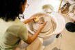 © Artem Podrez/Stocksy - Woman Ceramic Artist Work at Ceramic studio