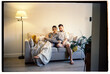 © Olga Romanova/Stocksy - Happy family couple relaxing in a cozy living room at their house
