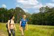 © Pedro Merino/Stocksy - women hiking on sunny day