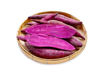 Wall Mural - Purple sweet potato in bamboo weave plate